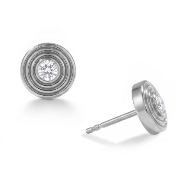 Rhodium plated concentric circle earrings with lab grown diamond.