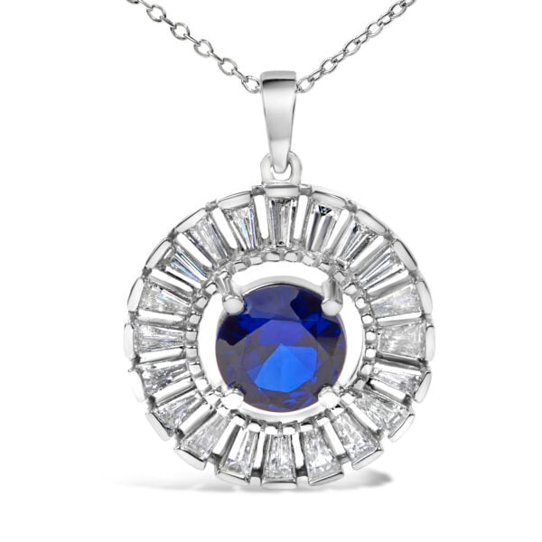 Close angle of the pendant showing the channel-set baguette diamonds around the blue center stone