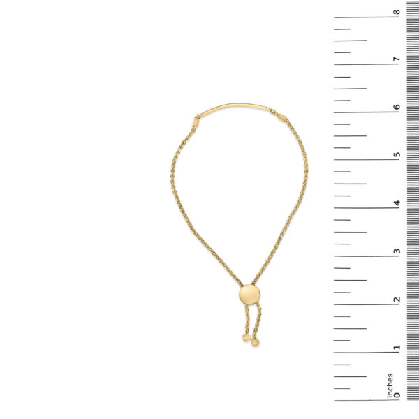 24K gold vermeil (plated) diamond bar bolo bracelet laid flat next to a ruler for scale reference