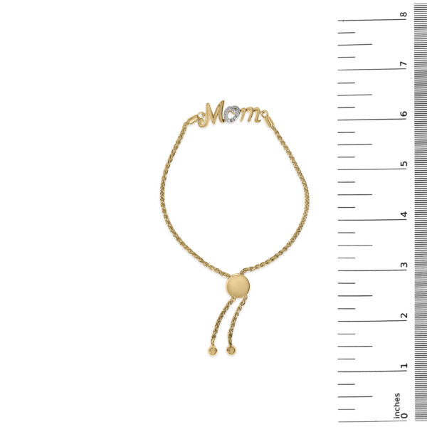 MOM lariat bolo bracelet next to a scale reference showing its size in inches