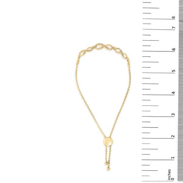 Bracelet shown next to a ruler indicating its length and scale