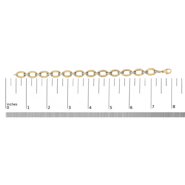 Bracelet photographed next to a scale reference to indicate its size
