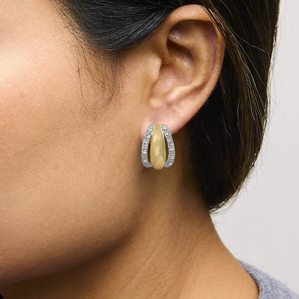 Half hoop earring worn on a model's ear