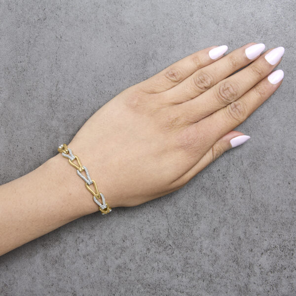 Bracelet worn on a wrist, showing the knot links draped in place