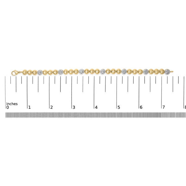 24K Gold plated bead link bracelet photographed next to a ruler for scale reference