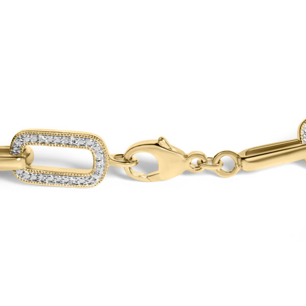 Close-up of the paperclip bracelet links showing pave diamond detail