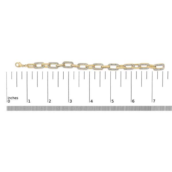 Paperclip bracelet shown next to a ruler for scale reference