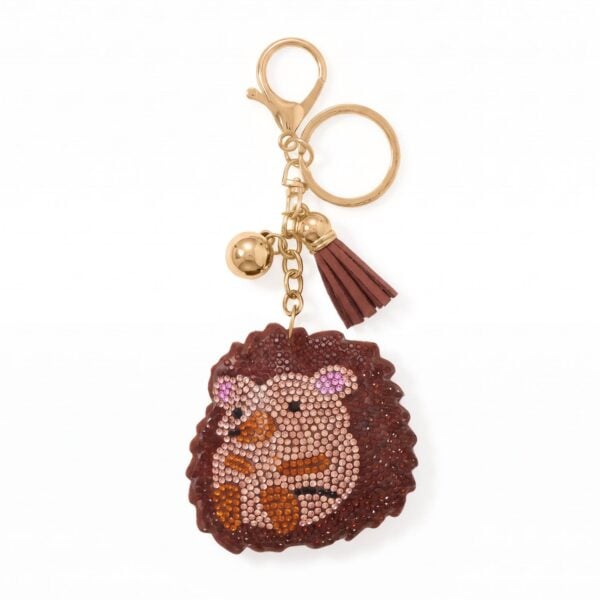 Brown crystal cuddly hedgehog bag charm with a gold plated finish.