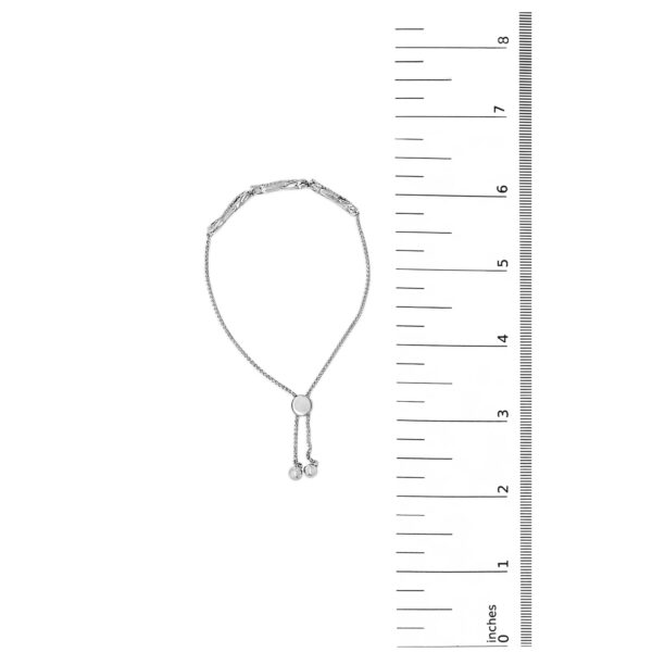 Bolo bracelet laid out to show its full 9 inch length next to a scale reference