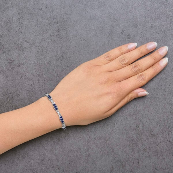 Sterling Silver 1/4 Cttw Diamond & Blue Sapphire Infinity Link Bracelet - alternate view 5